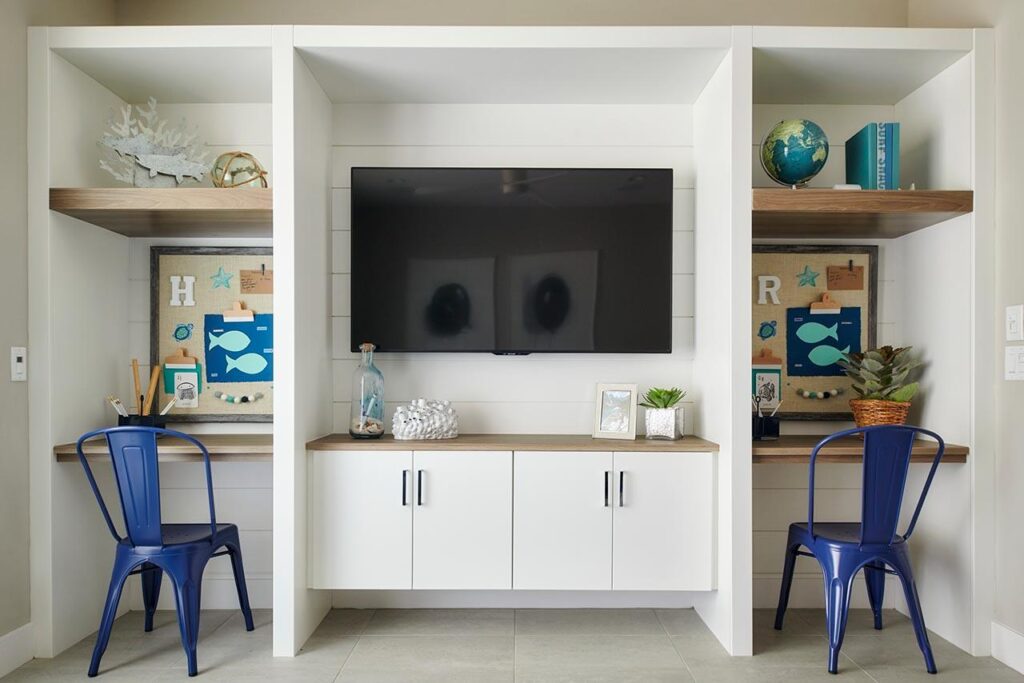White built-in cabinets and shelves for kids study in loft Hazel at The Preserve Tripointe Homes Chino