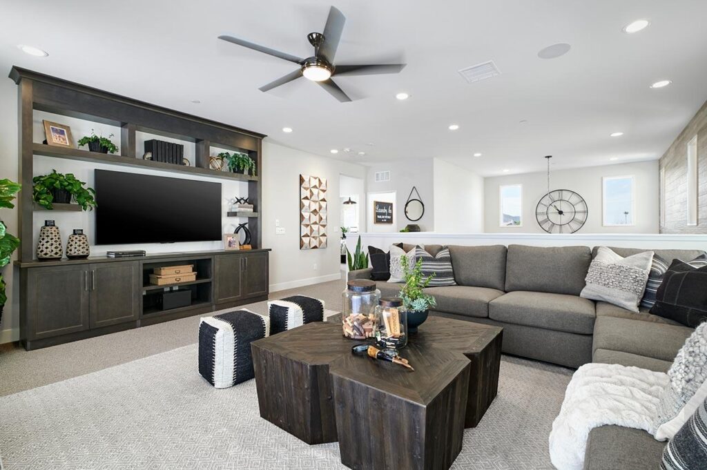 Dark-stained built-in media cabinet Cassis at Rancho Soleo Plan 2 Tripointe Homes Temecula
