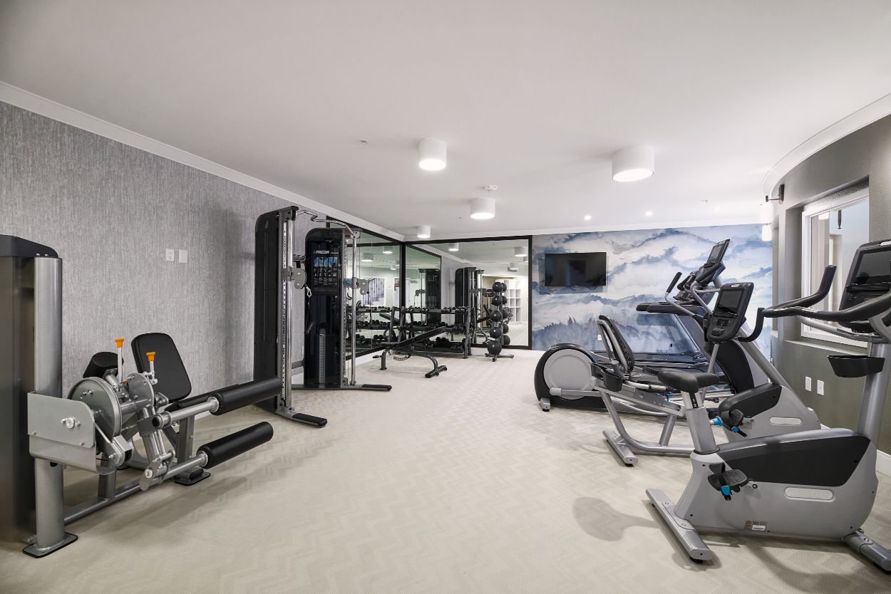 Indoor gym with fitness equipment The Retreat Midway City 33.74528228124775, -117.99286921960925