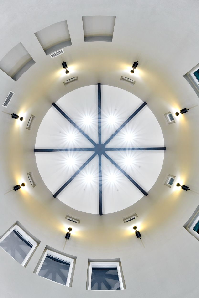 Rotunda domed ceiling with wall sconce uplights and beams The Retreat Midway City 33.74528228124775, -117.99286921960925